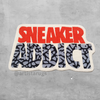 Image of a rug with sneaker addict