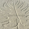 A close-up of a soft rug with delicate leaf 