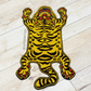 Picture of a tiger-themed rug on a wooden floor