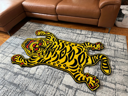 Image of a tiger rug with orange and black stripes