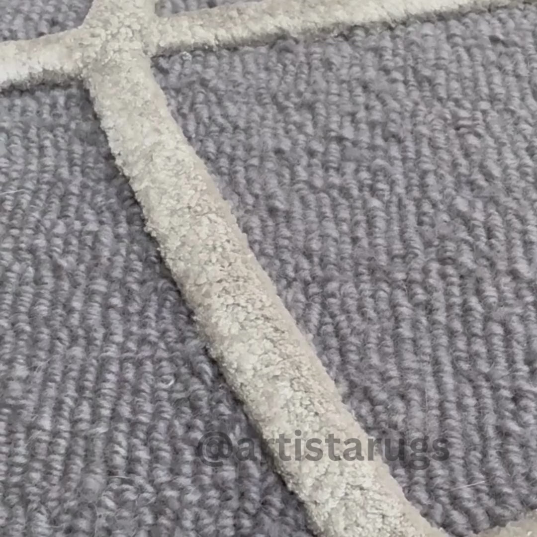 Detailed image of a textured rug featuring unique arch designs